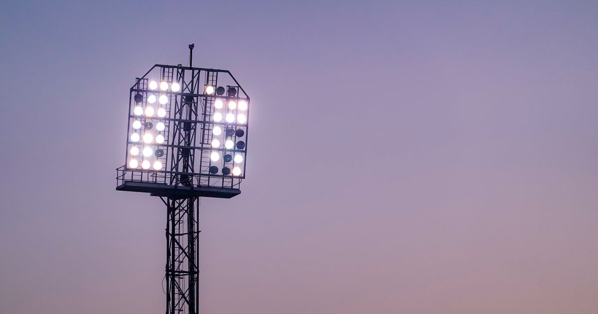 Watch every sport without cable - stadium floodlights at dusk - BoomTV
