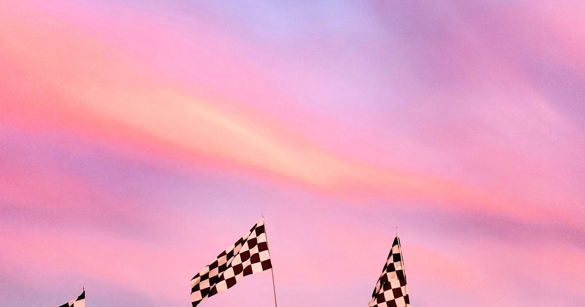 How to watch F1 in the US 2026 - checkered racing flags at sunset - BoomTV